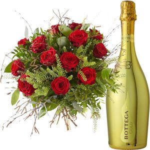 A bouquet of lovely red roses and a bottle Prosecco